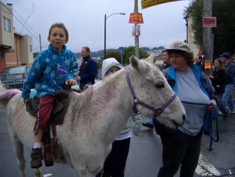 Isaac on horseback at Bernal Heights Street fair