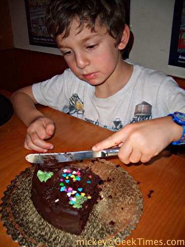 Isaac cuts the birthday cake