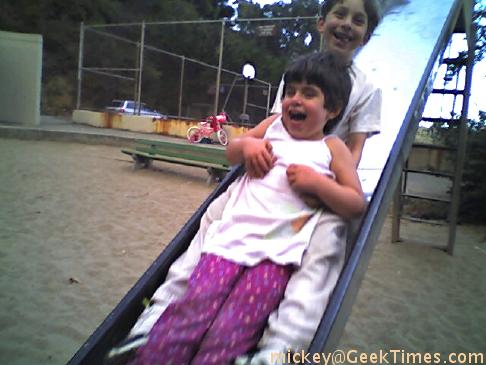 Lila & Isaac on a slide