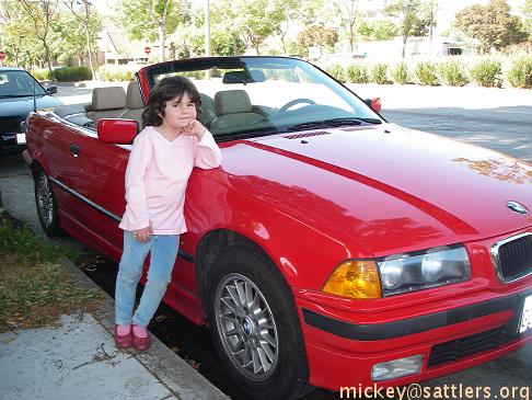 Lila poses with convertible