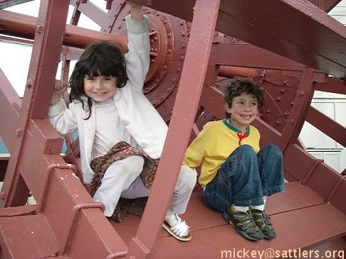 Isaac & Lila climb on the Hyde Street Pier paddle wheel