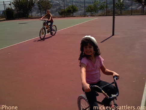 Lila and Isaac bicycling