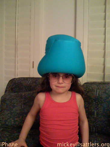 Lila wears bean-bag hat