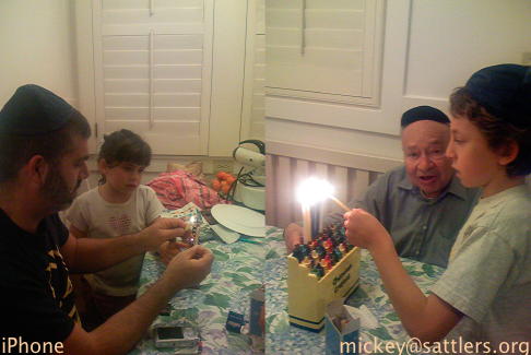 Isaac & Lila light the Chanukah candles