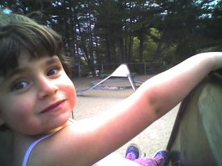 Lila on the playground slide