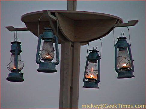 lanterns hanging from lamp-post