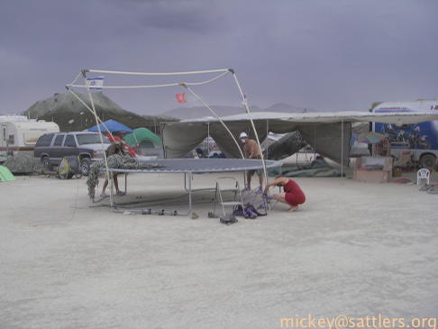 Burning Man 2007: Kidsville - battening down a PVC shade structure