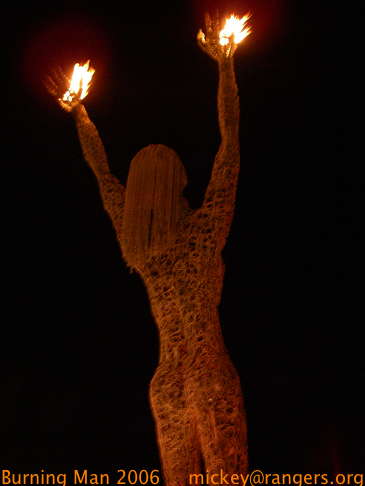 Burning Man 2006: nighttime: burning hands statue